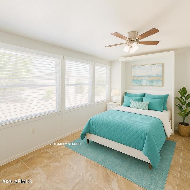 5342 E Des Moines St, Mesa, AZ 85205 - bedroom featuring light tile patterned floors, a ceiling fan, and baseboards