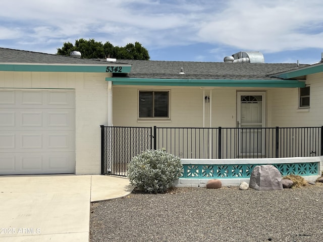 5342 E Des Moines St, Mesa, AZ 85205 - view of front of house with a shingled roof, a garage, and covered porch