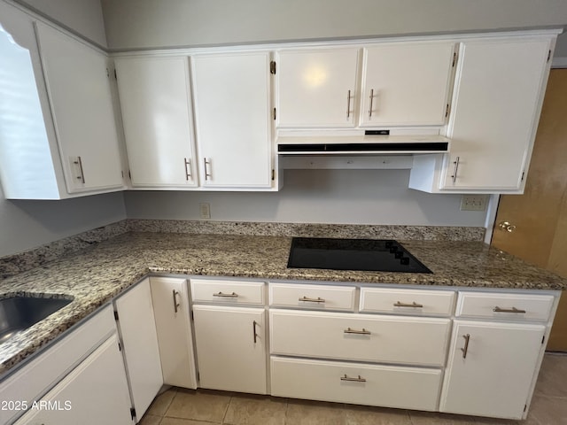 5342 E Des Moines St, Mesa, AZ 85205 - kitchen with under cabinet range hood, black electric stovetop, and white cabinets