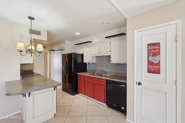 kitchen with black appliances, a notable chandelier, white cabinetry, and sink