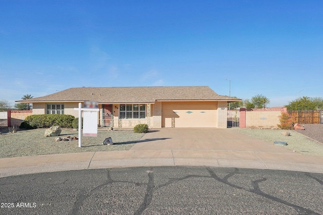 ranch-style house featuring a garage