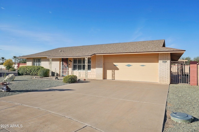 ranch-style house featuring a porch and a garage