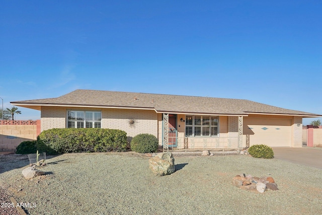 ranch-style home featuring a garage