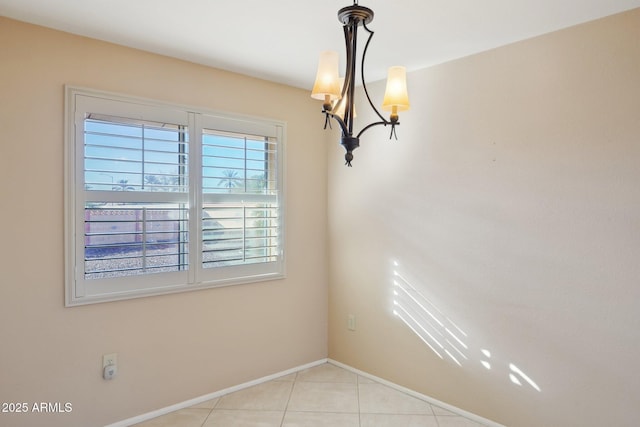 unfurnished dining area featuring light tile patterned floors and an inviting chandelier