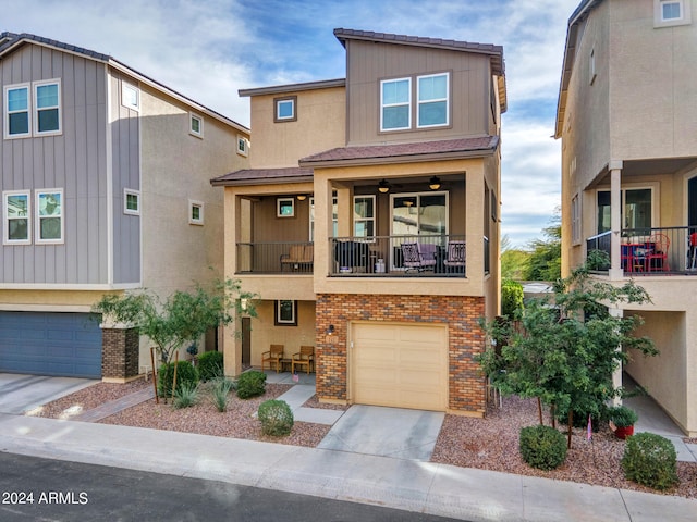 multi unit property with a balcony and a garage