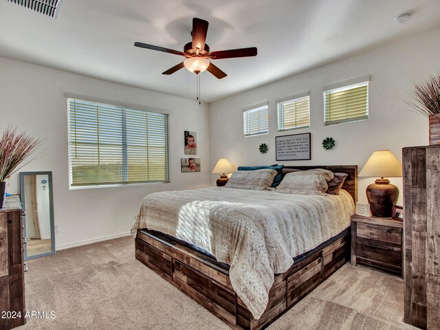 carpeted bedroom featuring ceiling fan