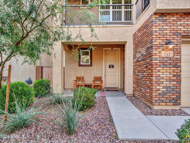 doorway to property featuring a balcony