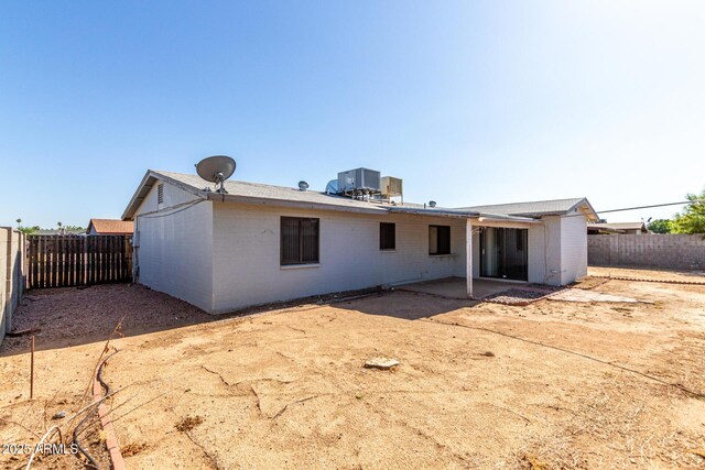 4740 W Bloomfield Rd, Glendale, AZ 85304 - back of property featuring a patio area, a fenced backyard, brick siding, and central air condition unit