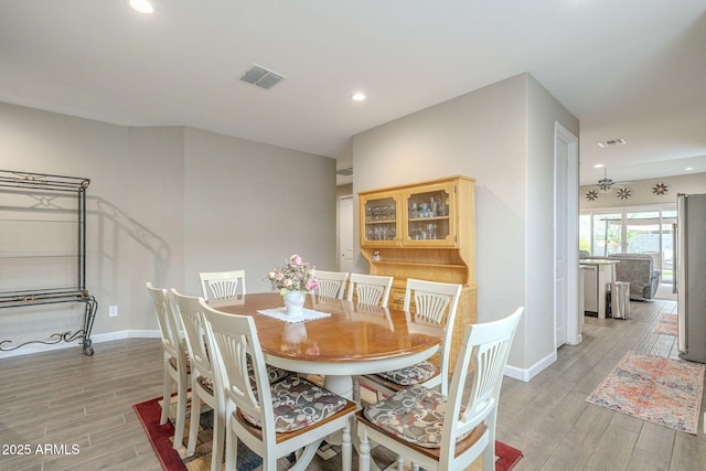 dining room featuring visible vents, recessed lighting, light wood-type flooring, and baseboards