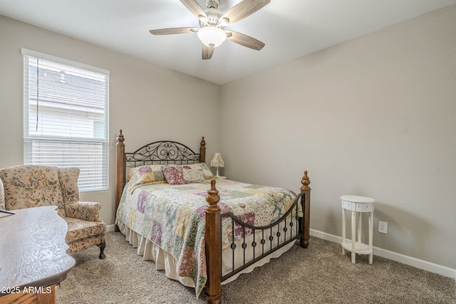 carpeted bedroom featuring ceiling fan and baseboards