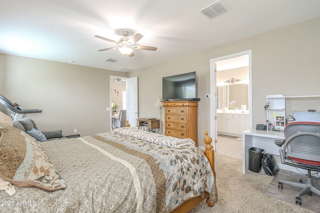 bedroom featuring visible vents, ensuite bathroom, a ceiling fan, and carpet flooring