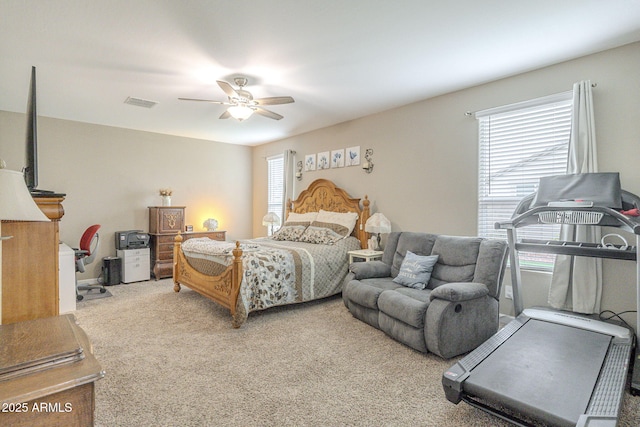 bedroom featuring carpet, visible vents, and ceiling fan