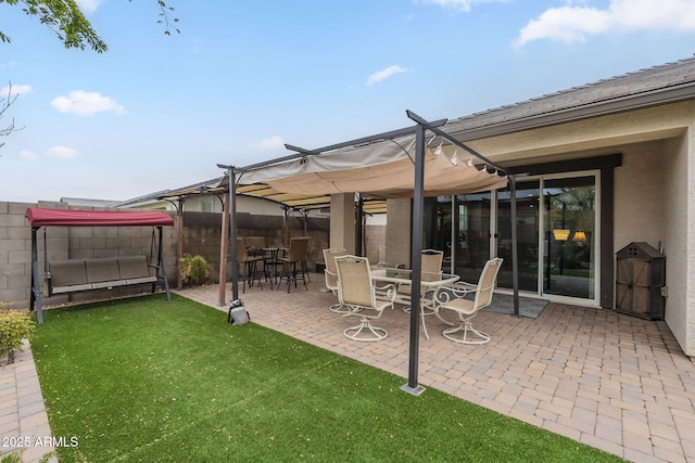 view of patio with a pergola and fence
