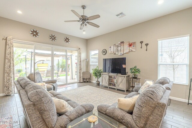 living room with visible vents, wood finished floors, recessed lighting, baseboards, and ceiling fan