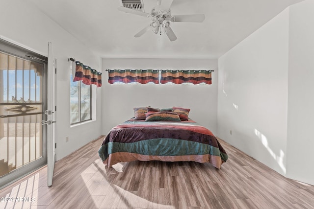 bedroom with light wood-type flooring and ceiling fan