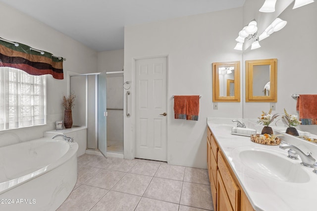 bathroom featuring vanity, tile patterned floors, and shower with separate bathtub