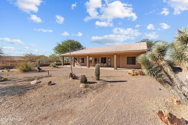 rear view of house featuring a patio