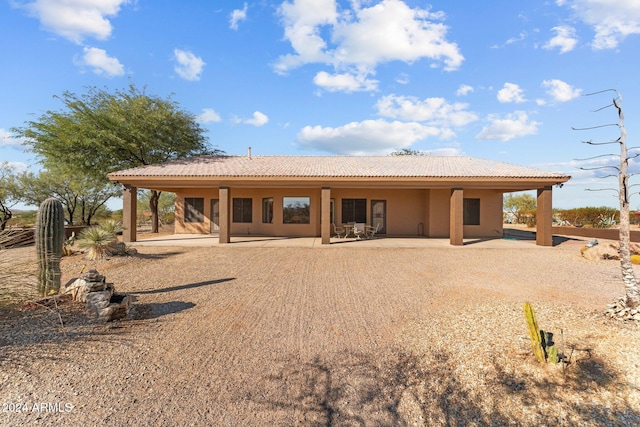 back of house featuring a patio area