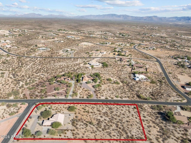 birds eye view of property with a mountain view