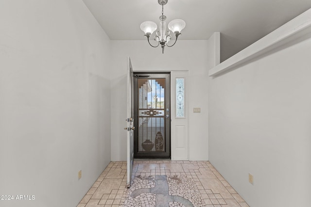 entrance foyer featuring a notable chandelier and light tile patterned floors