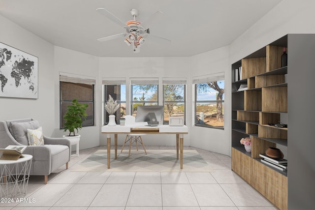 tiled home office featuring ceiling fan