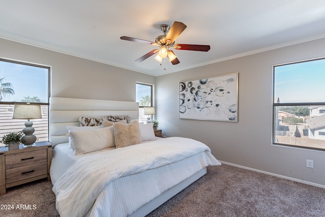 carpeted bedroom featuring ornamental molding and ceiling fan