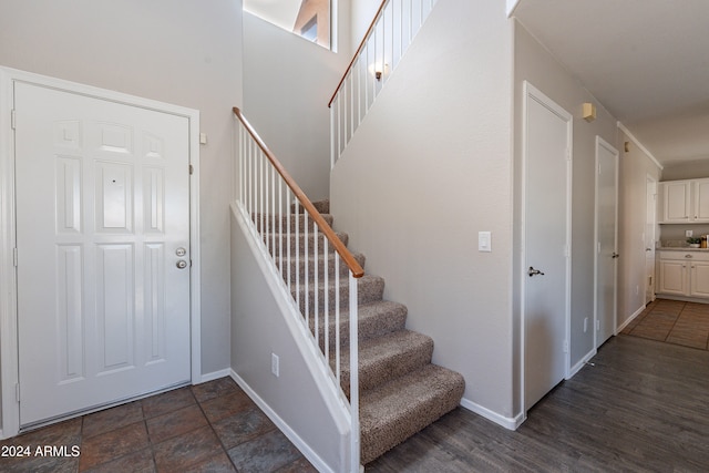 stairs featuring wood-type flooring