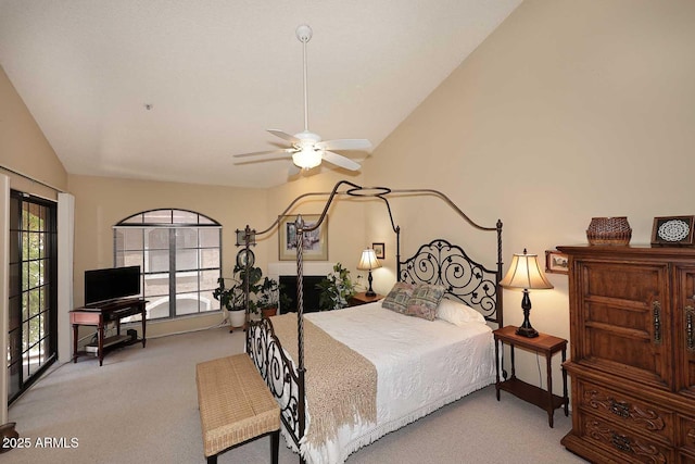 carpeted bedroom featuring ceiling fan and vaulted ceiling