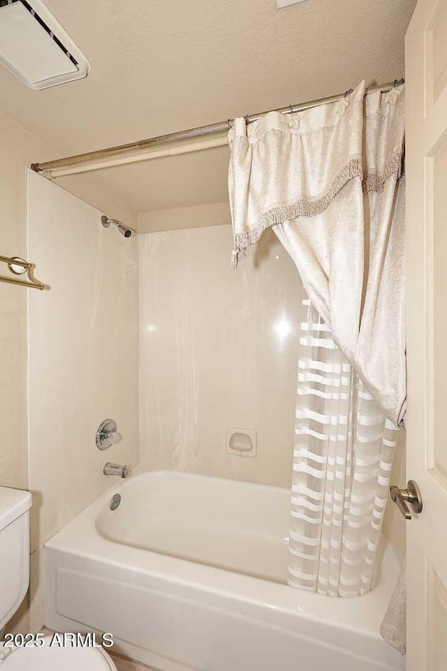 full bathroom with toilet and shower / bathtub combination with curtain