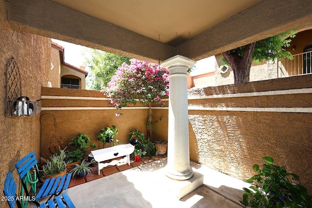 view of patio / terrace featuring fence