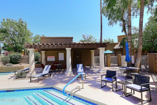 back of property with a community pool, a patio area, fence, a pergola, and stucco siding