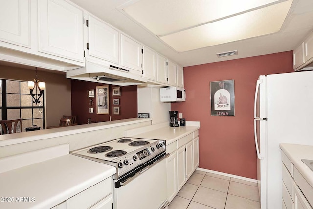 kitchen featuring light countertops, white cabinets, white appliances, and visible vents