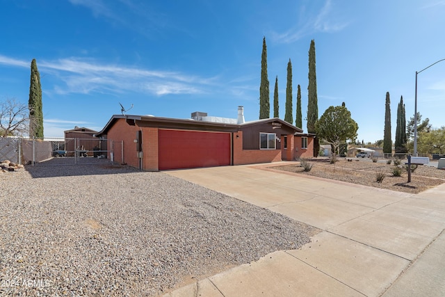 single story home with a garage