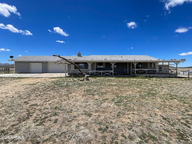 2995 W Rd 1 S, Chino Valley, AZ 86323 - view of front of house with an attached garage and a chimney