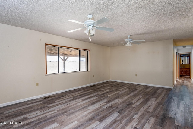 2995 W Rd 1 S, Chino Valley, AZ 86323 - unfurnished room featuring a ceiling fan, a textured ceiling, visible vents, baseboards, and dark wood-style floors