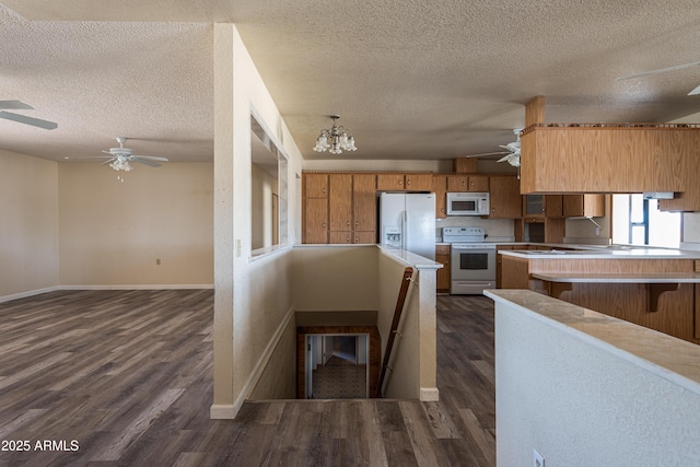 2995 W Rd 1 S, Chino Valley, AZ 86323 - kitchen with baseboards, white appliances, and ceiling fan with notable chandelier