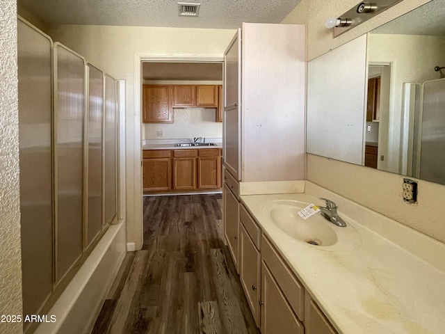 2995 W Rd 1 S, Chino Valley, AZ 86323 - full bathroom with visible vents, wood finished floors, a textured ceiling, and vanity