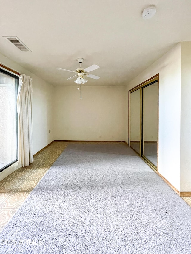 2995 W Rd 1 S, Chino Valley, AZ 86323 - spare room with light carpet, baseboards, visible vents, and a ceiling fan