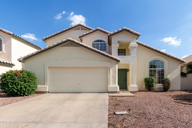 1421 E Charleston Ave, Phoenix, AZ 85022 - mediterranean / spanish house with an attached garage, a tile roof, driveway, and stucco siding