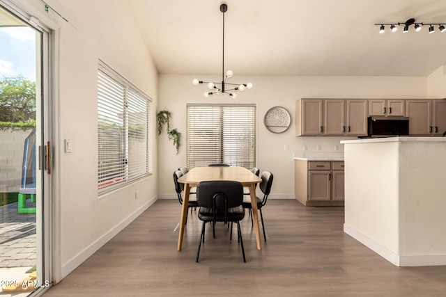 1421 E Charleston Ave, Phoenix, AZ 85022 - dining area featuring a chandelier, baseboards, and light wood finished floors