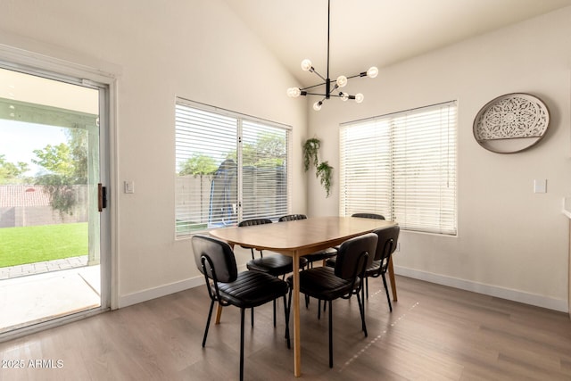 1421 E Charleston Ave, Phoenix, AZ 85022 - dining room featuring a chandelier, wood finished floors, baseboards, and high vaulted ceiling