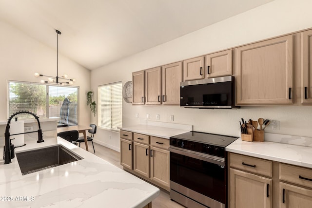 1421 E Charleston Ave, Phoenix, AZ 85022 - kitchen featuring appliances with stainless steel finishes, a sink, lofted ceiling, light stone counters, and decorative light fixtures