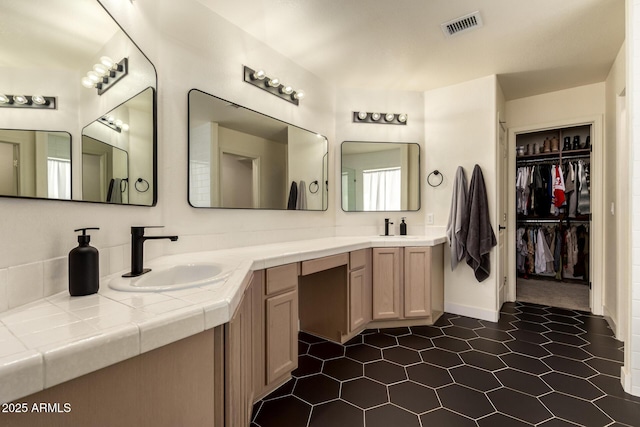 1421 E Charleston Ave, Phoenix, AZ 85022 - bathroom featuring double vanity and a walk in closet