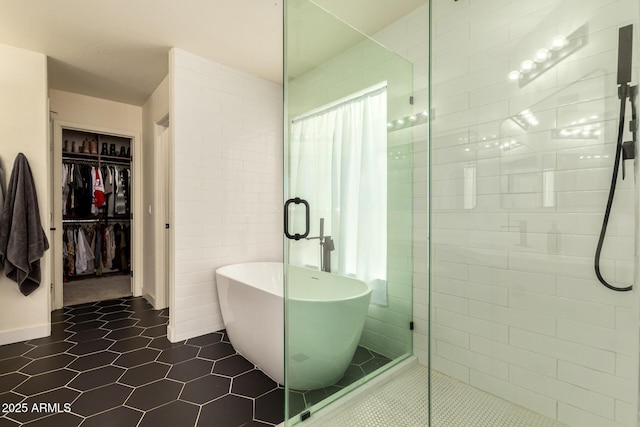 1421 E Charleston Ave, Phoenix, AZ 85022 - full bathroom with a stall shower, a freestanding bath, tile patterned flooring, and a spacious closet