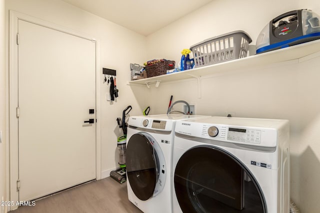 1421 E Charleston Ave, Phoenix, AZ 85022 - laundry area with light wood-style floors and separate washer and dryer