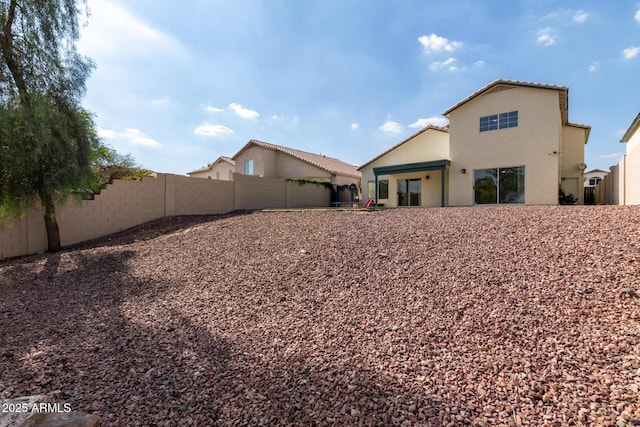 1421 E Charleston Ave, Phoenix, AZ 85022 - rear view of house with a fenced backyard and stucco siding