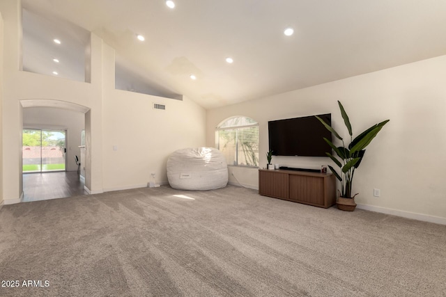 1421 E Charleston Ave, Phoenix, AZ 85022 - living room with carpet, recessed lighting, baseboards, arched walkways, and high vaulted ceiling