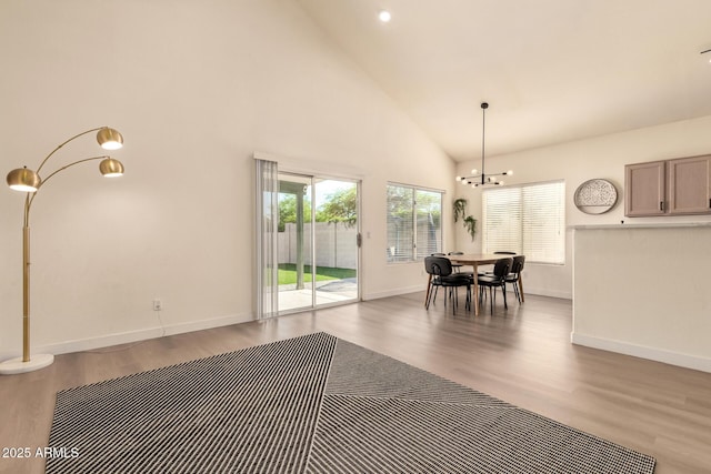 1421 E Charleston Ave, Phoenix, AZ 85022 - dining room with wood finished floors, a chandelier, high vaulted ceiling, and baseboards