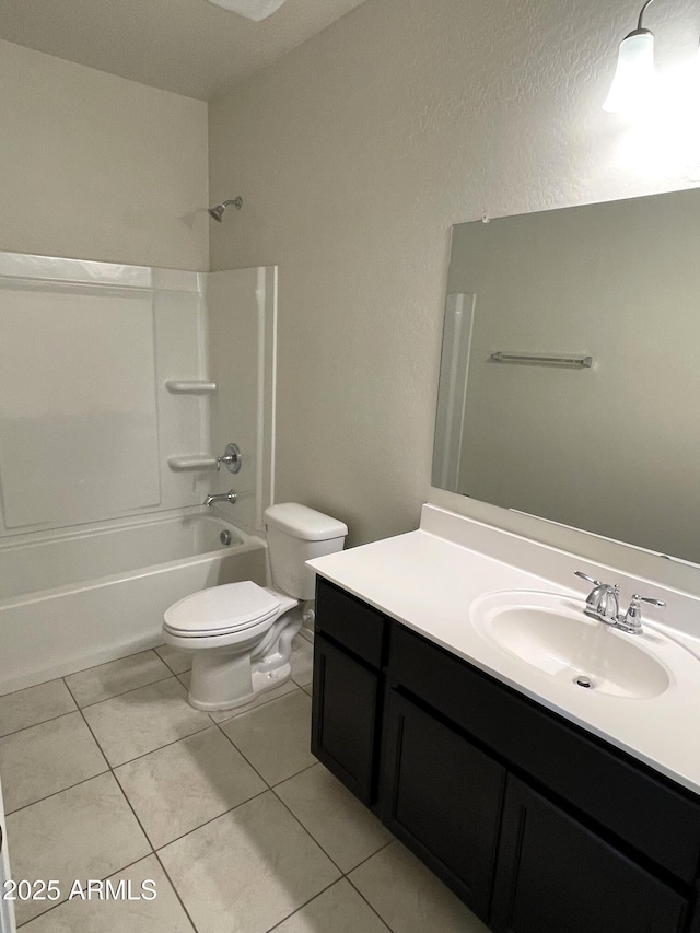 full bathroom with washtub / shower combination, tile patterned floors, vanity, and toilet