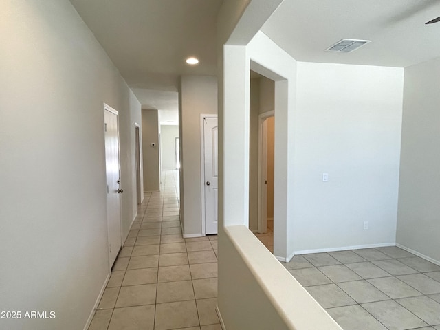 hallway with light tile patterned flooring